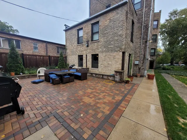 a car parked in front of brick building