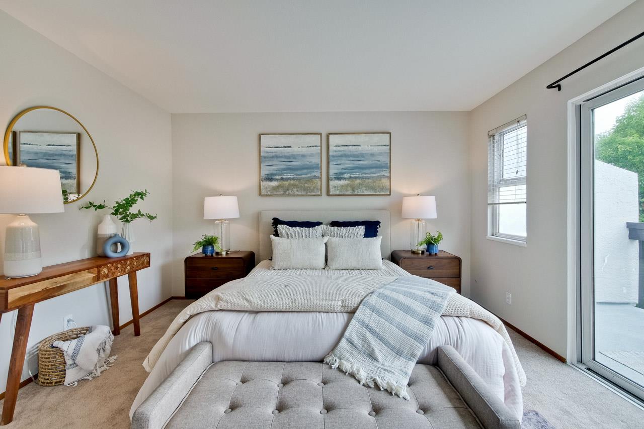 1046 Wright Avenue, Unit J Mountain View, CA 94043 - Photo 23 of 36 a bed sitting in a bedroom next to a window