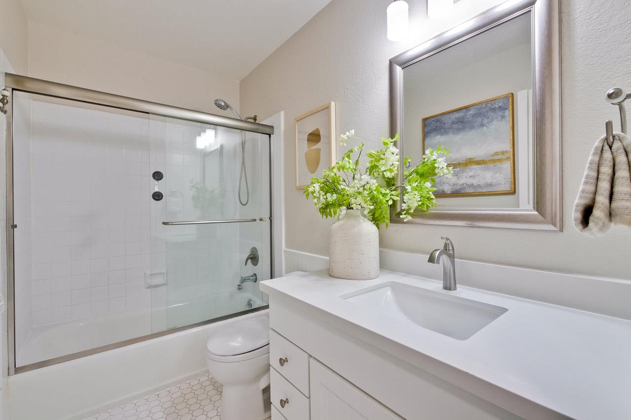1046 Wright Avenue, Unit J Mountain View, CA 94043 - Photo 26 of 36 a bathroom with a sink a toilet and shower