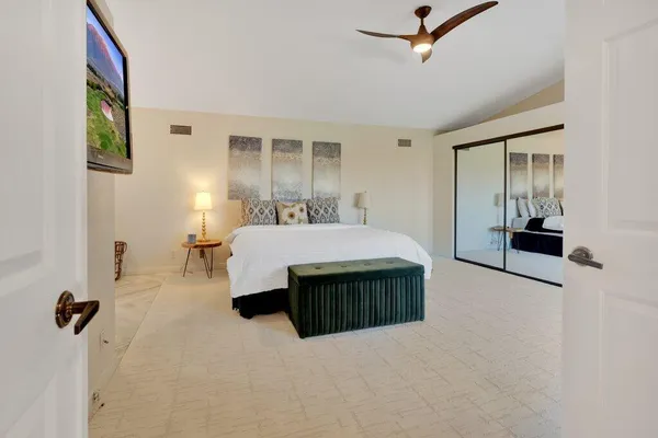 a living room with a bed furniture and a window