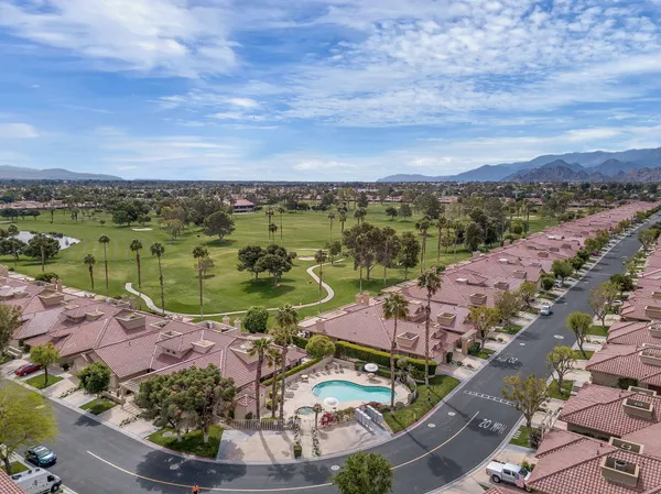 an aerial view of lake and city