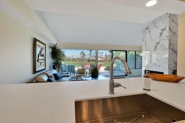 a view of a living room and chandelier