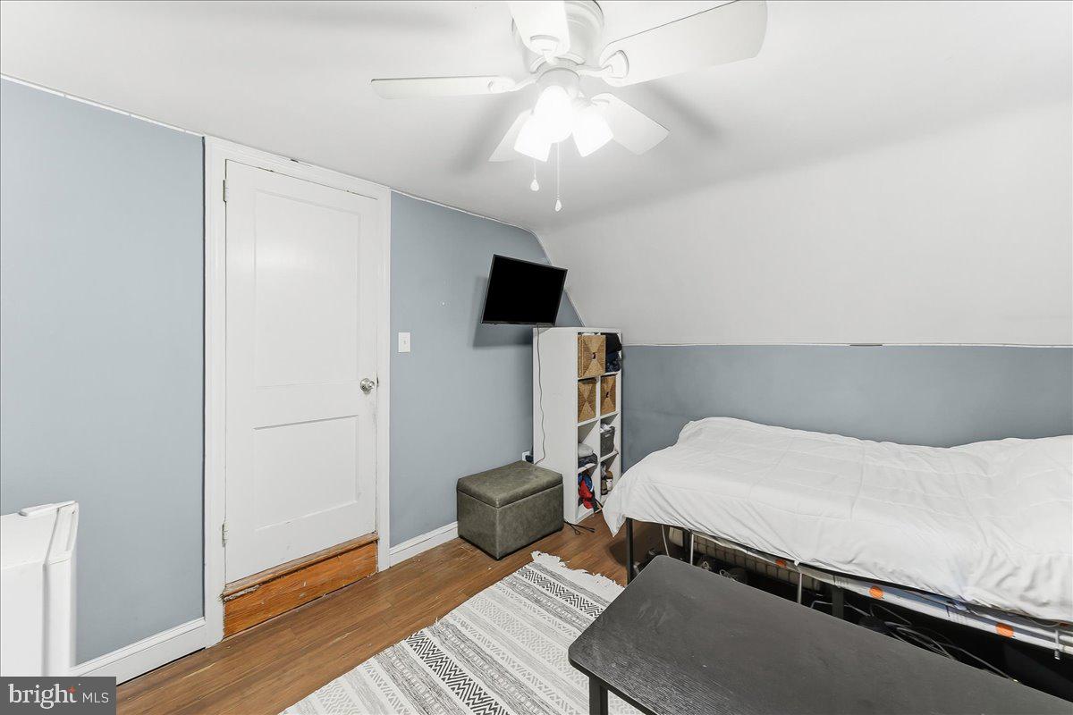 601 Willowbrook Road Havertown, PA 19083 - Photo 12 of 25 a bedroom with a bed and wooden floor