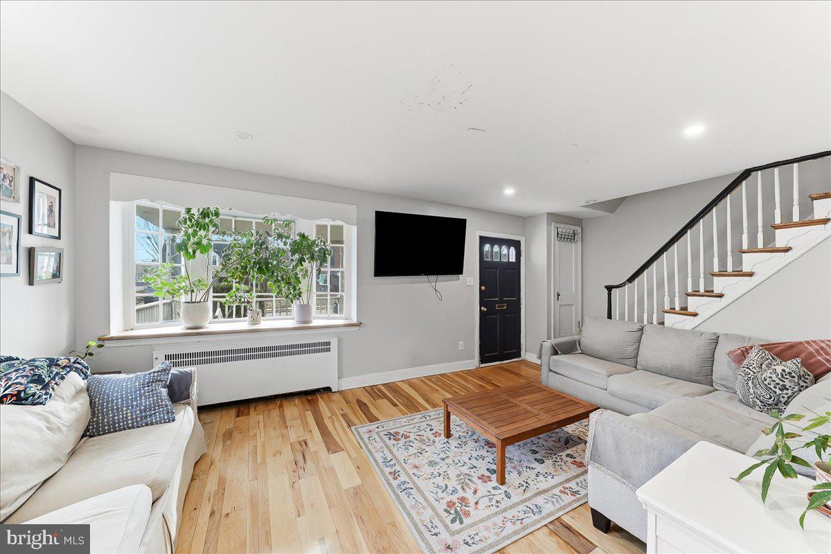 601 Willowbrook Road Havertown, PA 19083 - Photo 2 of 25 a living room with a couch and a flat screen tv