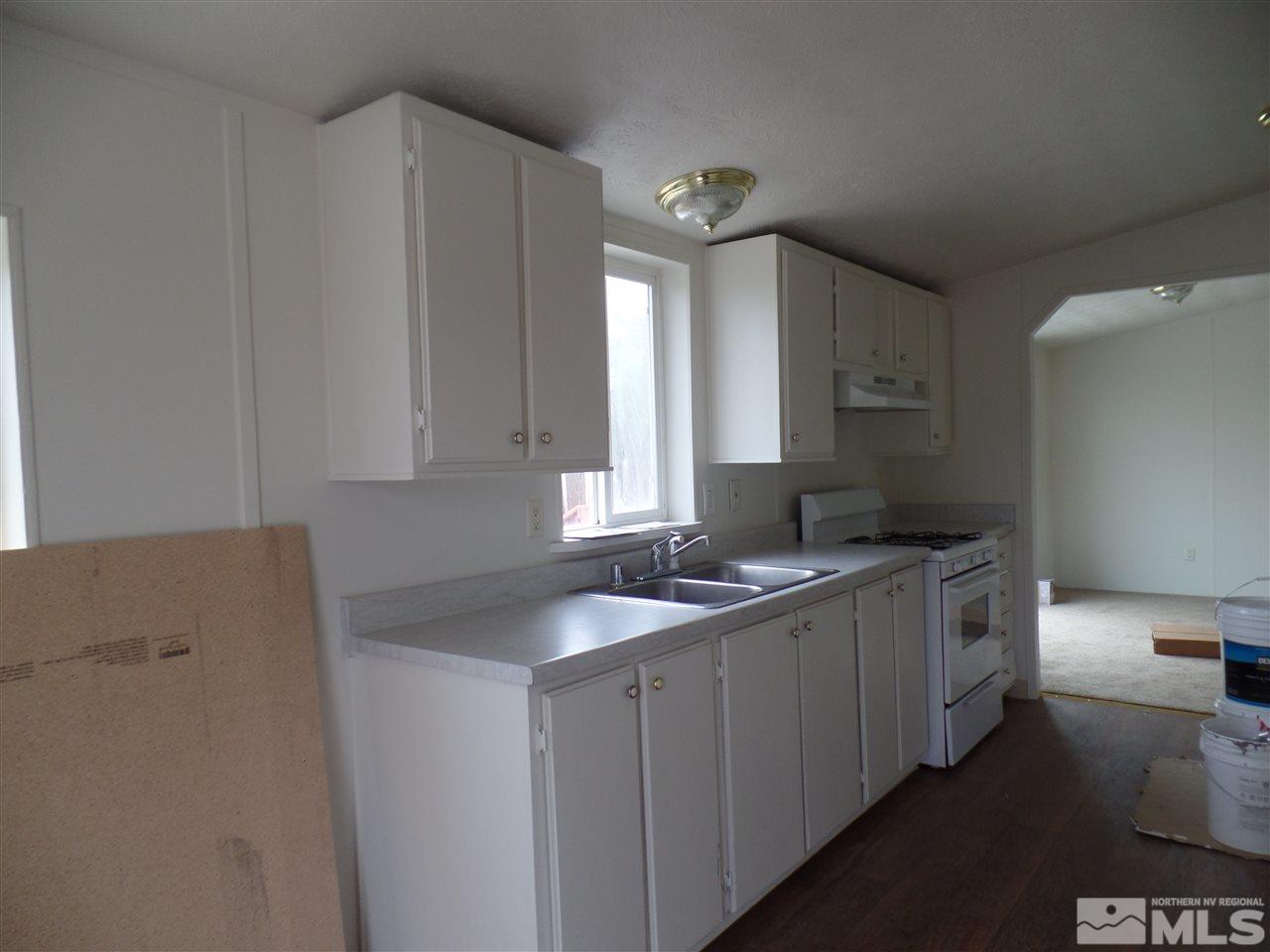 1055 Chisholm Trail Reno, NV 89506 - Photo 3 of 9 a kitchen with a sink and cabinets