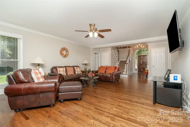 a living room with furniture fireplace and a flat screen tv