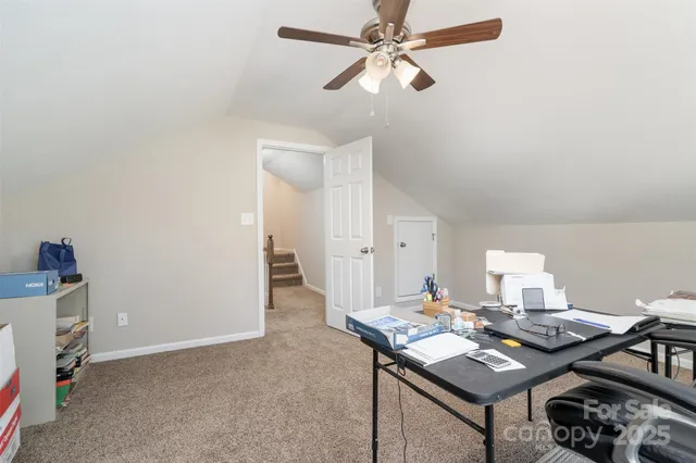a view of a workspace with furniture