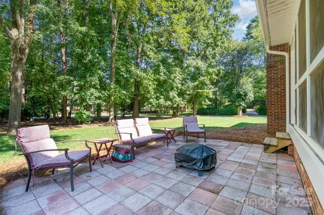 a view of a chair and tables in the patio