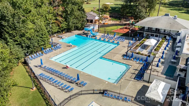 an aerial view of a house with outdoor space