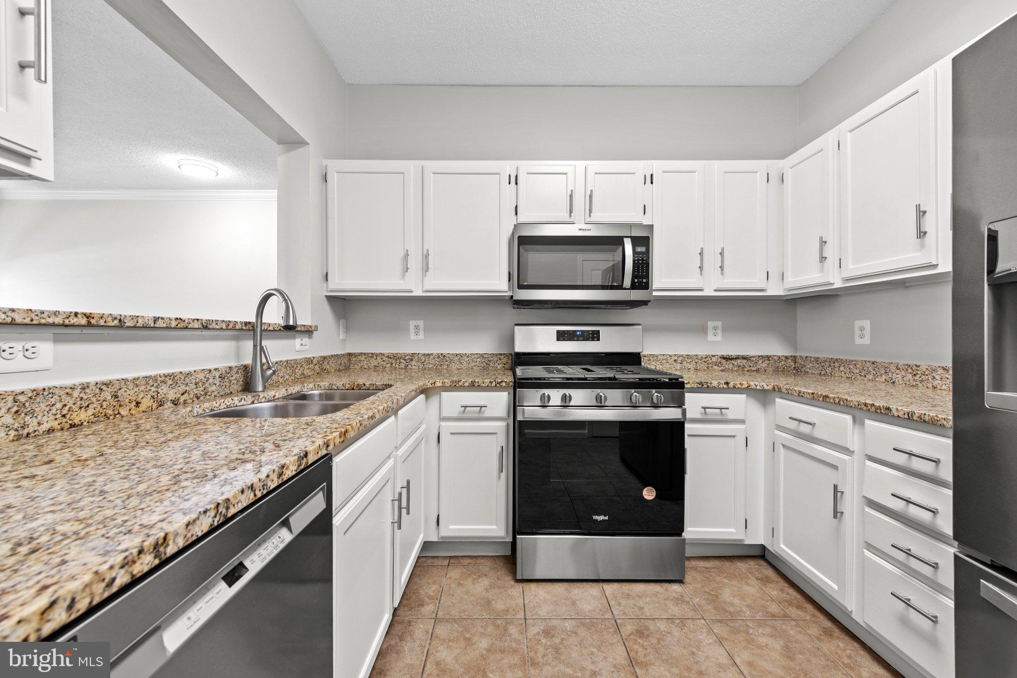 12001 Taliesin Place, Unit 12 Reston, VA 20190 - Photo 11 of 20 Kitchen: New Microwave & Newer appliances