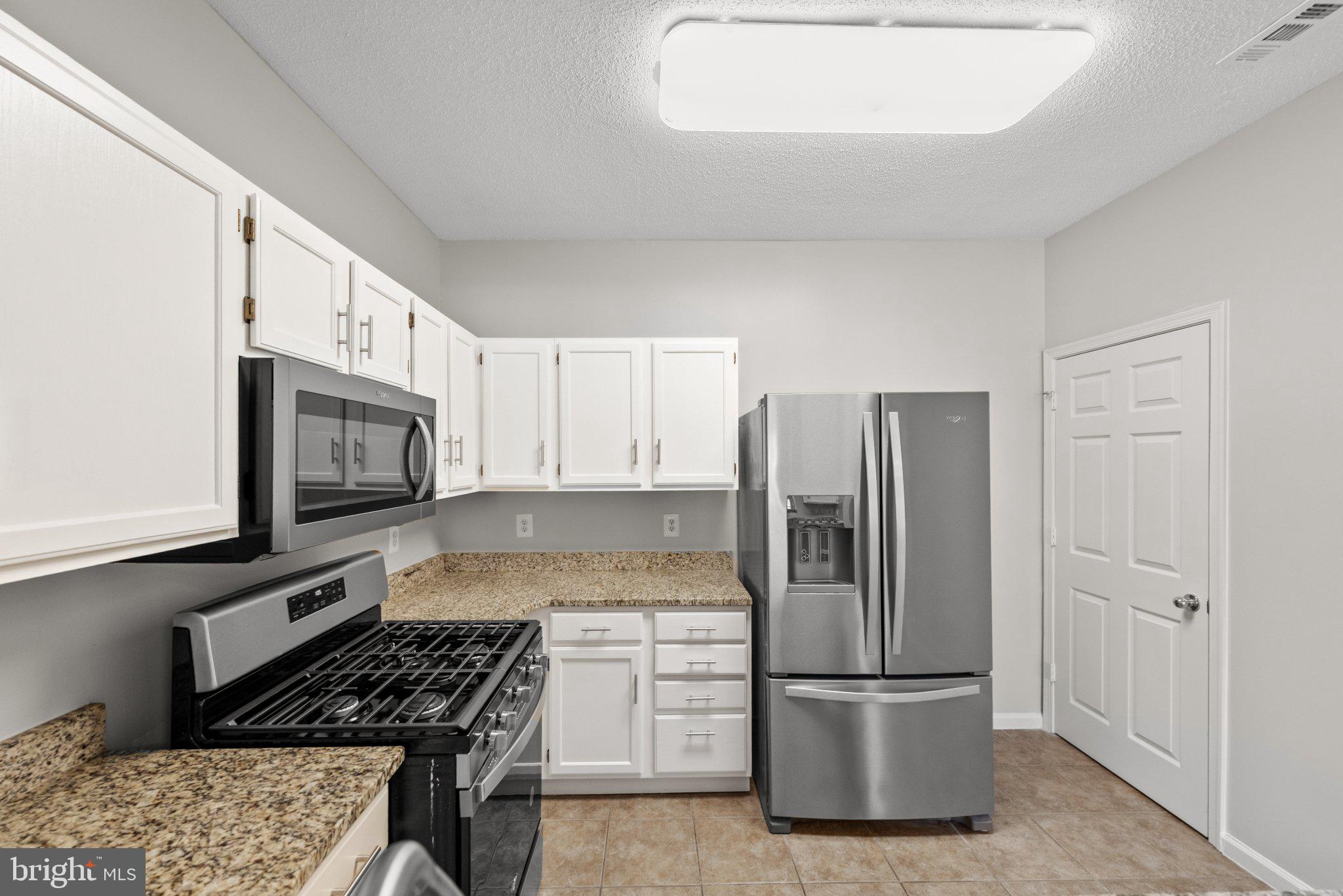 12001 Taliesin Place, Unit 12 Reston, VA 20190 - Photo 8 of 20 Kitchen: New Microwave & Newer appliances