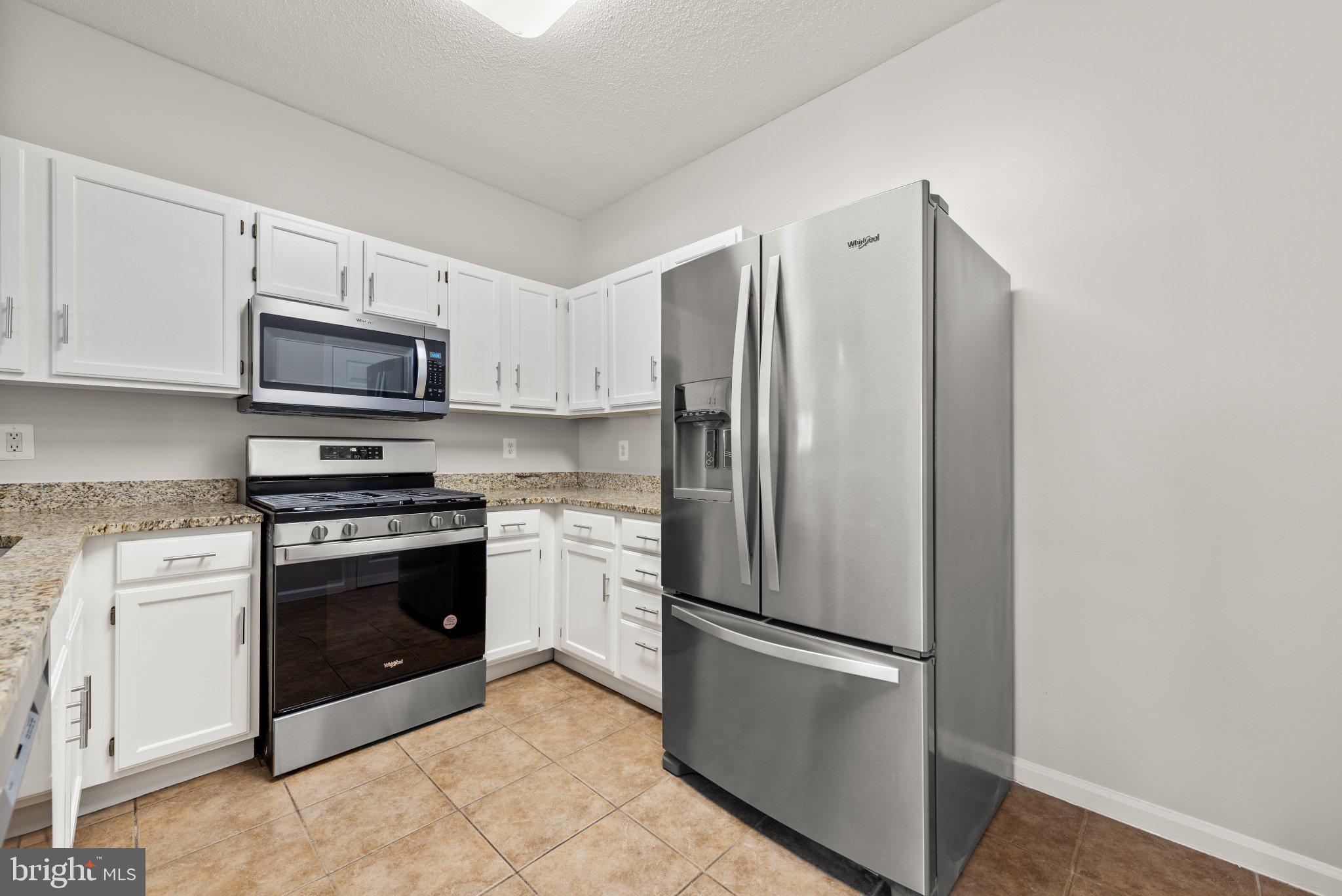 12001 Taliesin Place, Unit 12 Reston, VA 20190 - Photo 10 of 20 Kitchen: New Microwave & Newer appliances