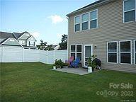 8019 Red Water Road Charlotte, NC 28277 - Photo 11 of 13 a front view of a house with a garden and plants