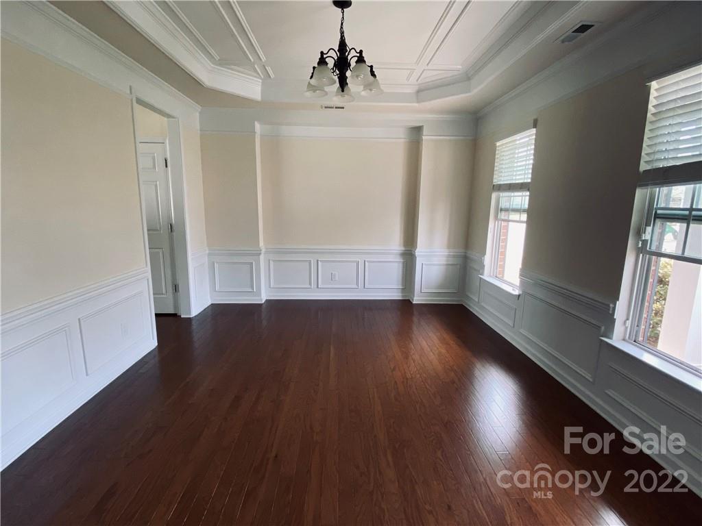 8019 Red Water Road Charlotte, NC 28277 - Photo 3 of 13 wooden floor in an empty room with a window