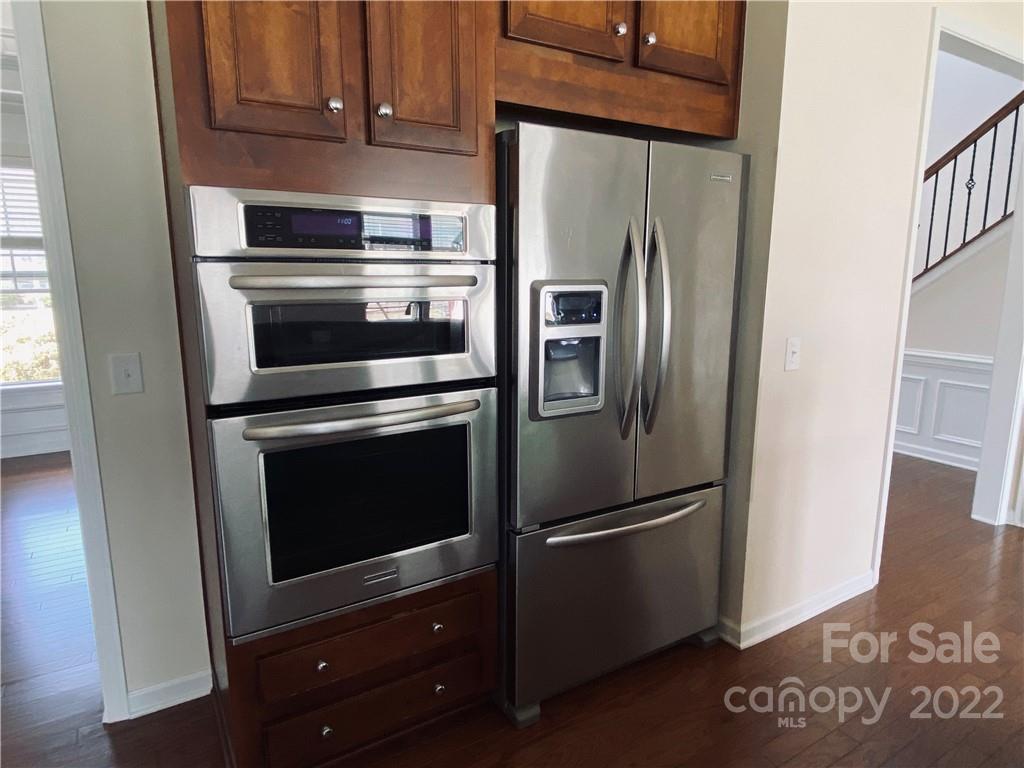 8019 Red Water Road Charlotte, NC 28277 - Photo 5 of 13 a metallic refrigerator freezer sitting in a kitchen