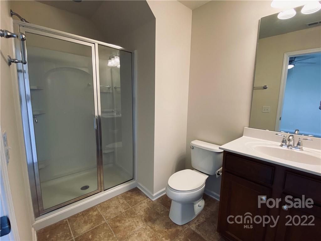 8019 Red Water Road Charlotte, NC 28277 - Photo 10 of 13 a bathroom with a sink a toilet and shower