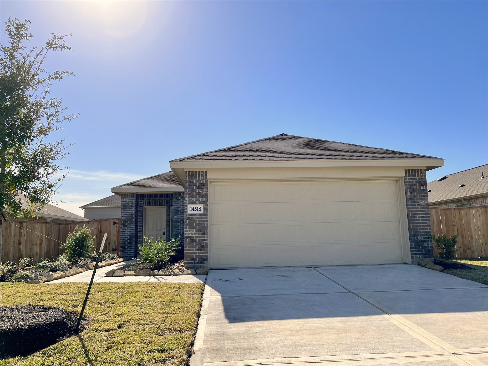 14518 Woodcott Warren Way Rosharon, TX 77583 - Photo 1 of 18 a front view of a house with a yard
