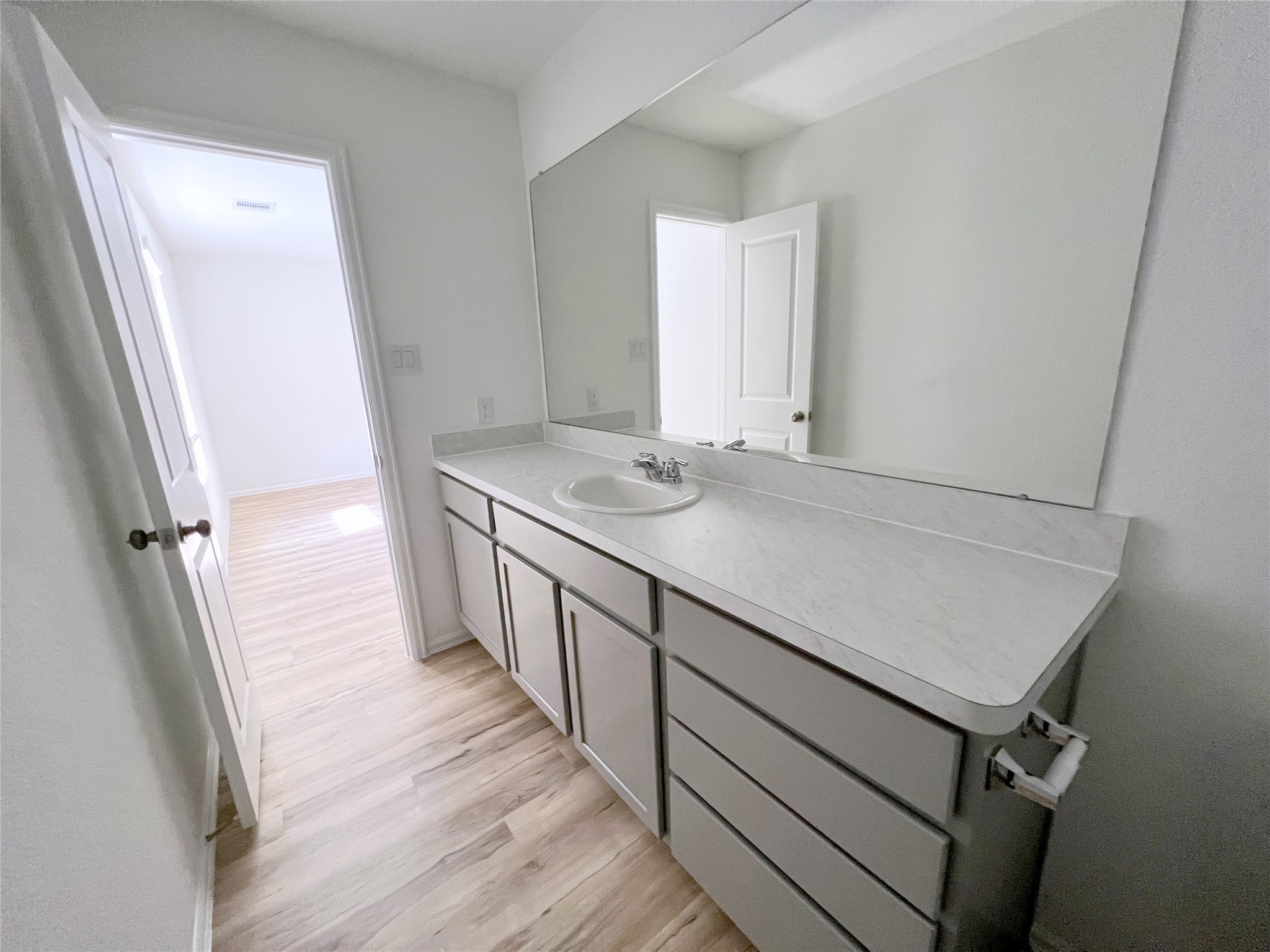 14518 Woodcott Warren Way Rosharon, TX 77583 - Photo 12 of 18 a view of a hallway with wooden floor and staircase
