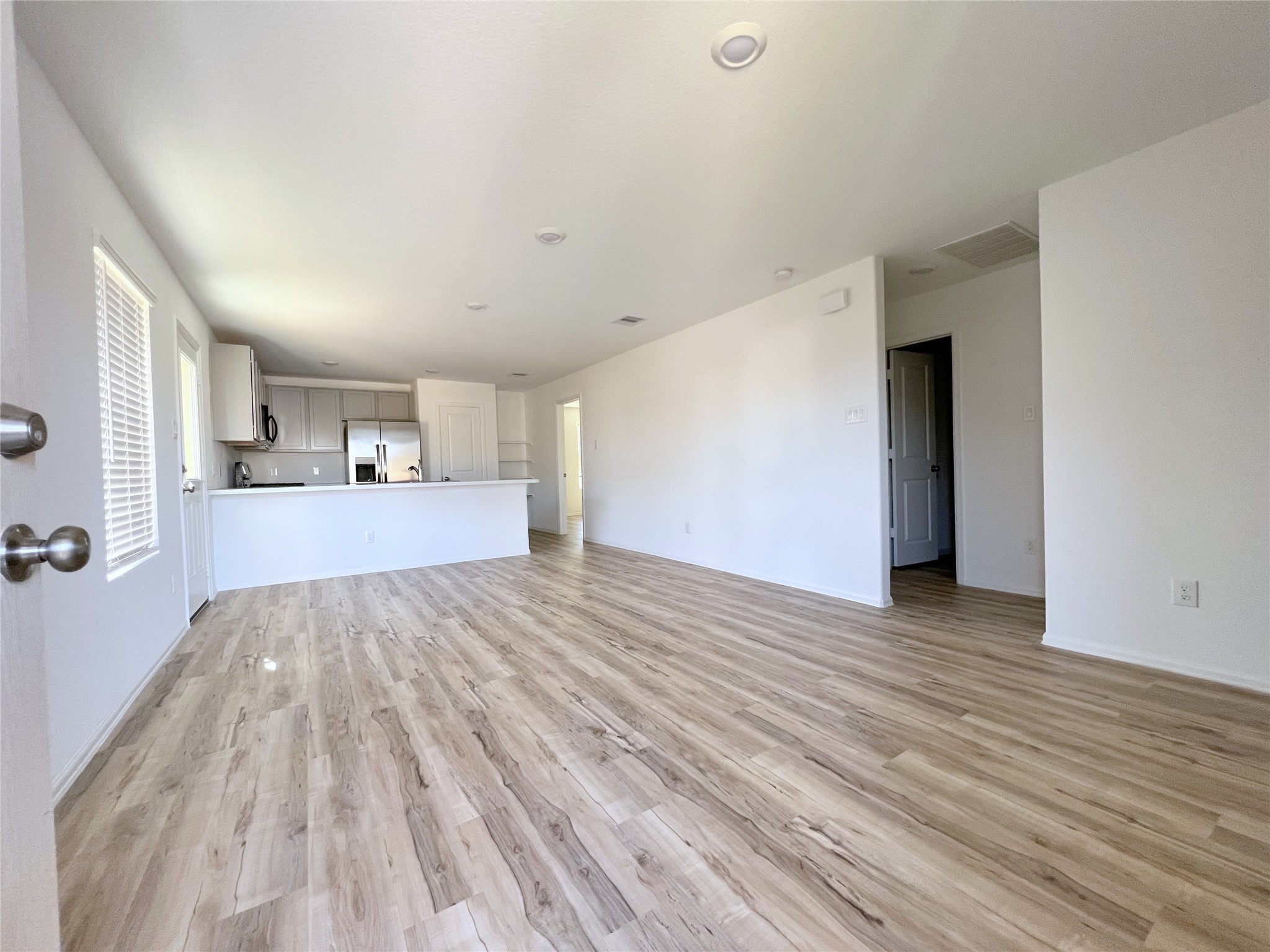 14518 Woodcott Warren Way Rosharon, TX 77583 - Photo 3 of 18 a view of empty room with wooden floor
