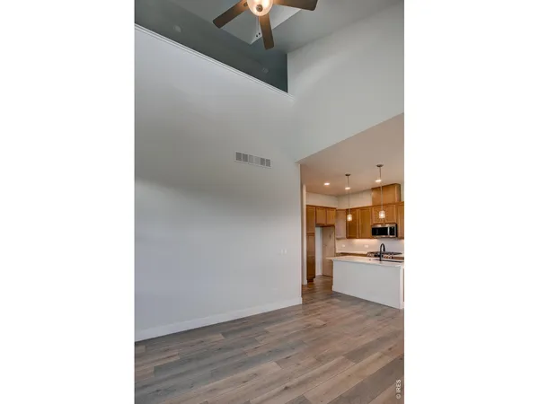 a view of a kitchen with a sink and a kitchen view