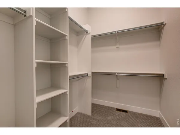 a view of an empty walk in closet