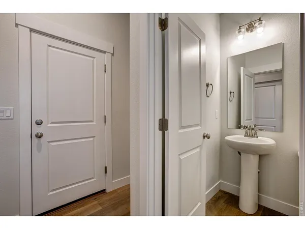 a bathroom with a sink a mirror and a toilet