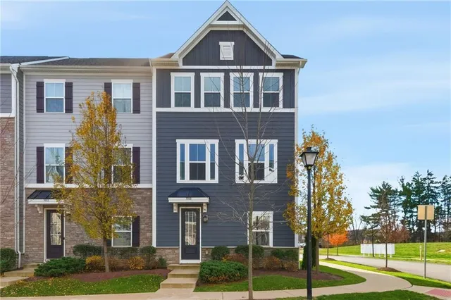 a front view of a building with garden
