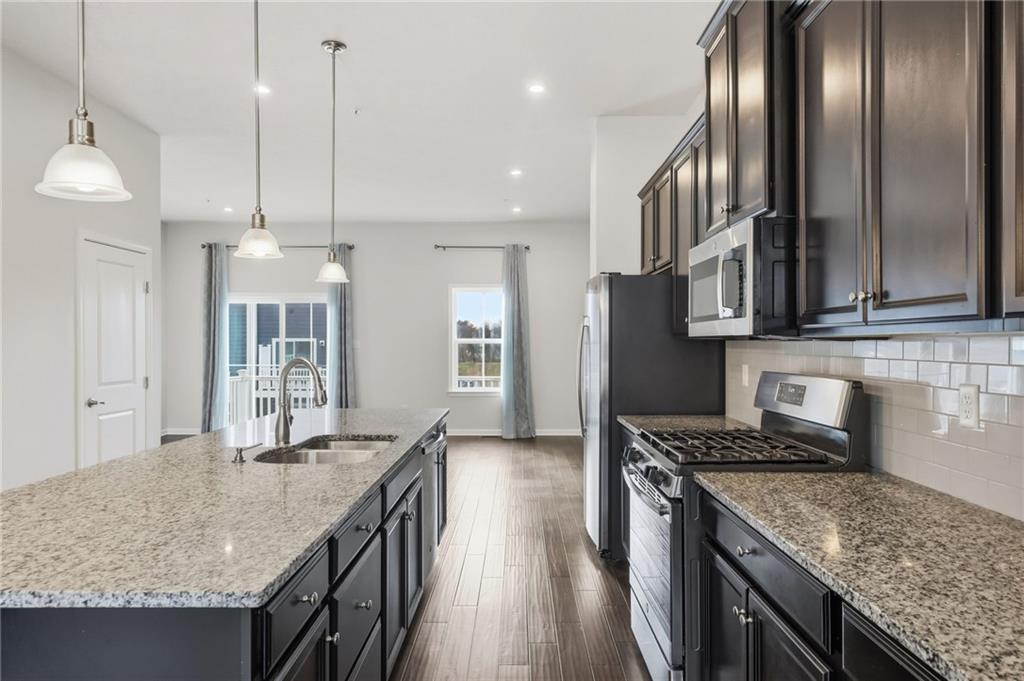 3000 Mahican Circle Mars, PA 16046 - Photo 14 of 39 a kitchen with stainless steel appliances granite countertop granite counter tops wooden cabinets and a granite counter tops