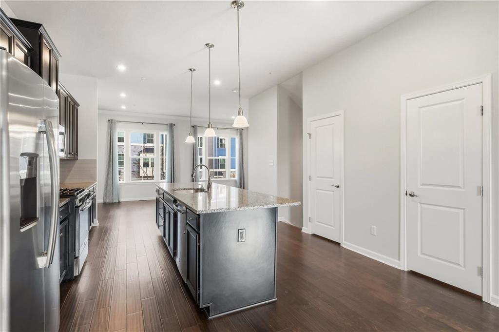 3000 Mahican Circle Mars, PA 16046 - Photo 17 of 39 a kitchen with stainless steel appliances granite countertop a refrigerator a stove and a wooden floors