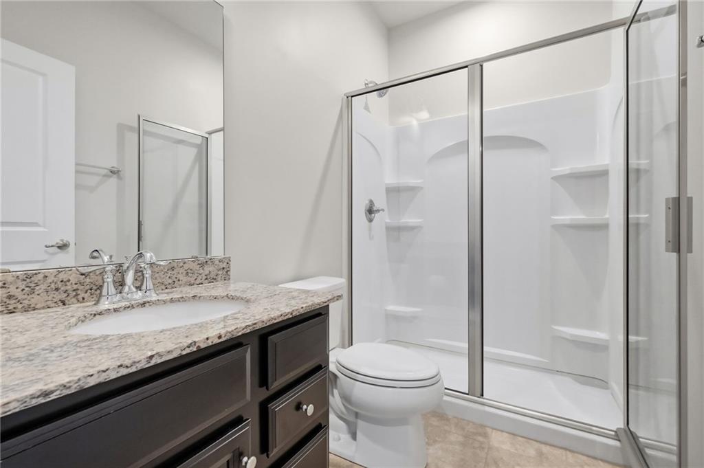 3000 Mahican Circle Mars, PA 16046 - Photo 35 of 39 a bathroom with a granite countertop sink toilet and shower