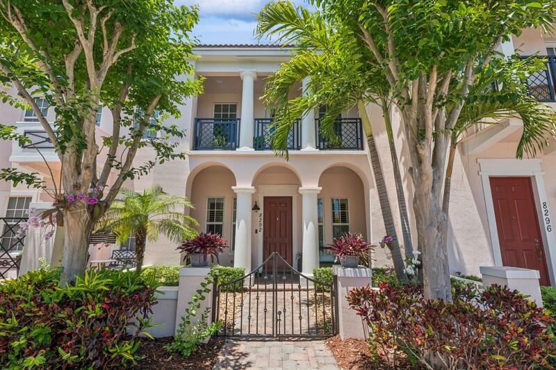 8292 Northwest 9th Avenue Boca Raton, FL 33487 - Photo 1 of 15 front view of a house with a garden