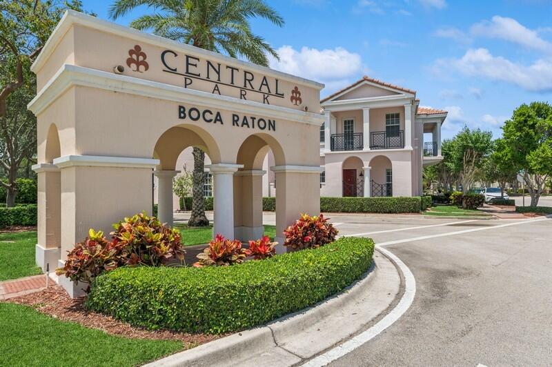 8292 Northwest 9th Avenue Boca Raton, FL 33487 - Photo 3 of 15 a front view of building with garden