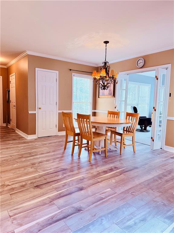 3830 Peachbluff Court Duluth, GA 30097 - Photo 11 of 39 a dining room with furniture entryway and wooden floor