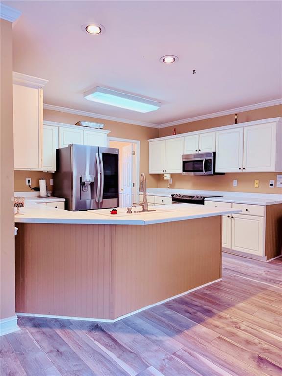 3830 Peachbluff Court Duluth, GA 30097 - Photo 12 of 39 a kitchen with stainless steel appliances granite countertop a sink cabinets and wooden floor