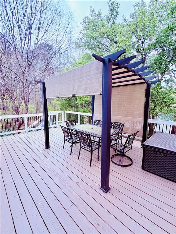 3830 Peachbluff Court Duluth, GA 30097 - Photo 21 of 39 a backyard of a house with wooden floor outdoor seating and yard in the back