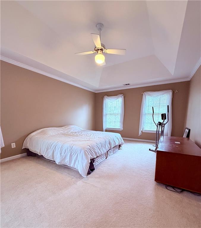 3830 Peachbluff Court Duluth, GA 30097 - Photo 22 of 39 a spacious bedroom with a bed and a couch