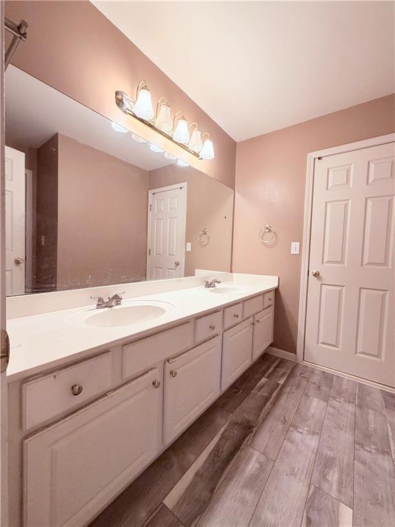 3830 Peachbluff Court Duluth, GA 30097 - Photo 28 of 39 a spacious bathroom with a double vanity sink and a mirror