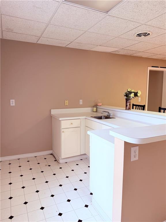 3830 Peachbluff Court Duluth, GA 30097 - Photo 30 of 39 a utility room with a sink a cabinetry and a window