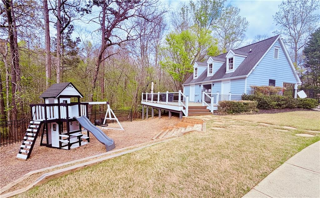 3830 Peachbluff Court Duluth, GA 30097 - Photo 38 of 39 a view of a house with backyard and trees