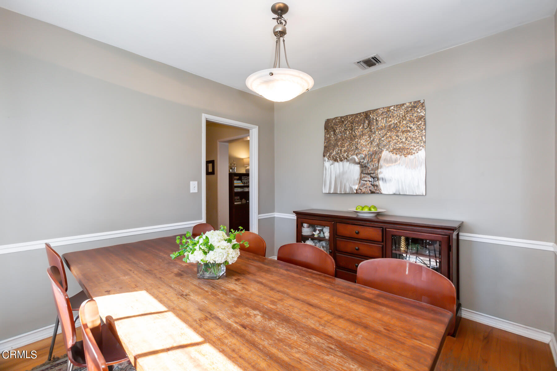 781 Morada Place Altadena, CA 91001 - Photo 11 of 41 a bedroom with a bed and a chandelier