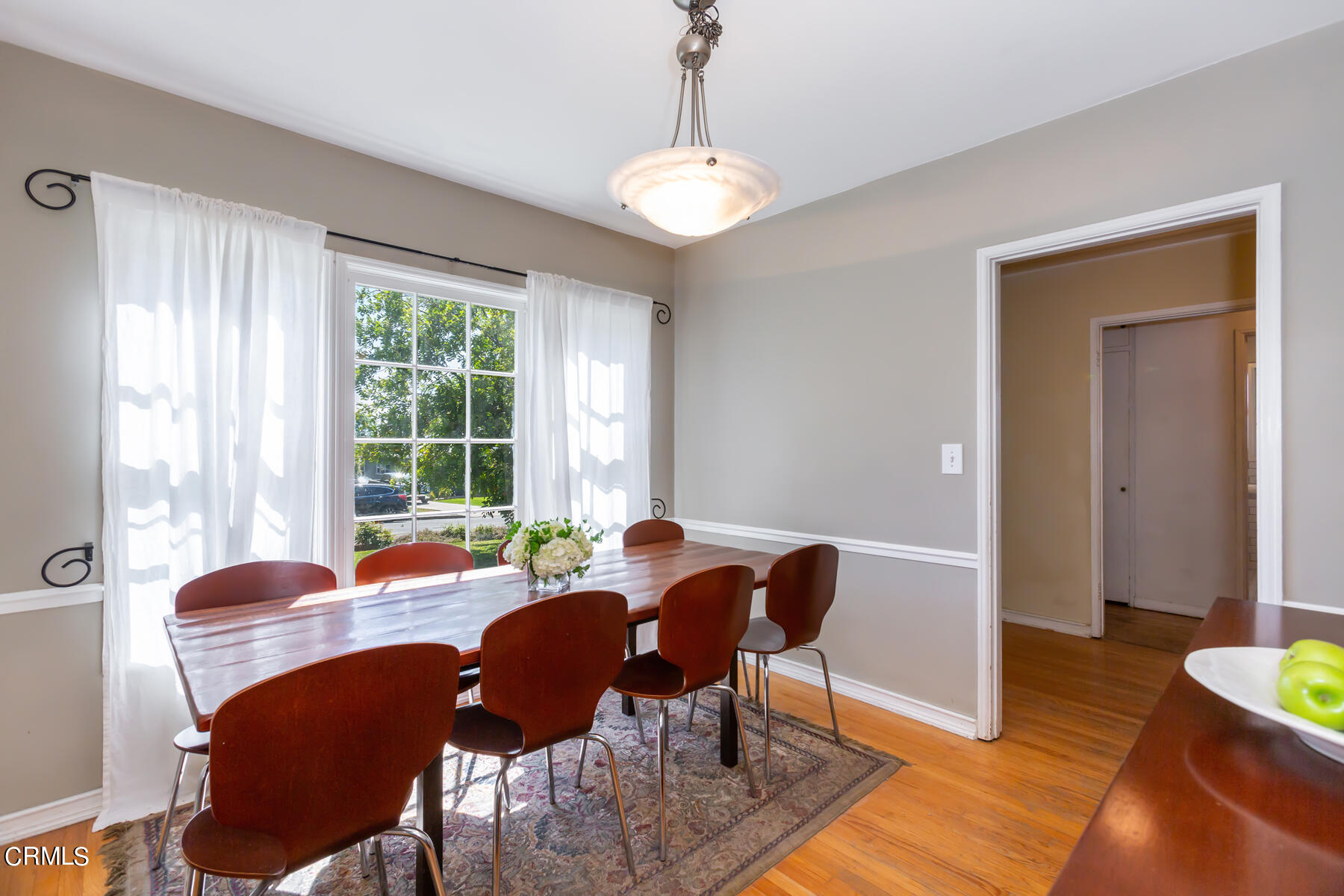 781 Morada Place Altadena, CA 91001 - Photo 12 of 41 a view of a dining room with furniture window and wooden floor