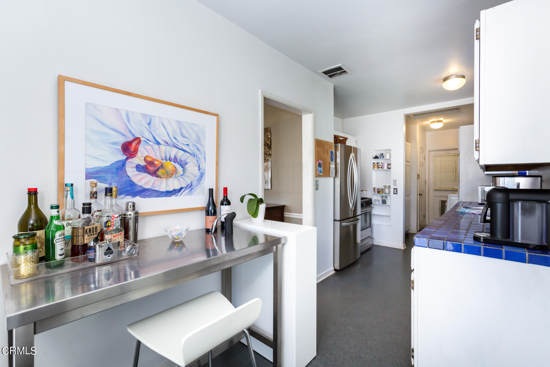781 Morada Place Altadena, CA 91001 - Photo 15 of 41 a living room with stainless steel appliances kitchen island a table and chairs