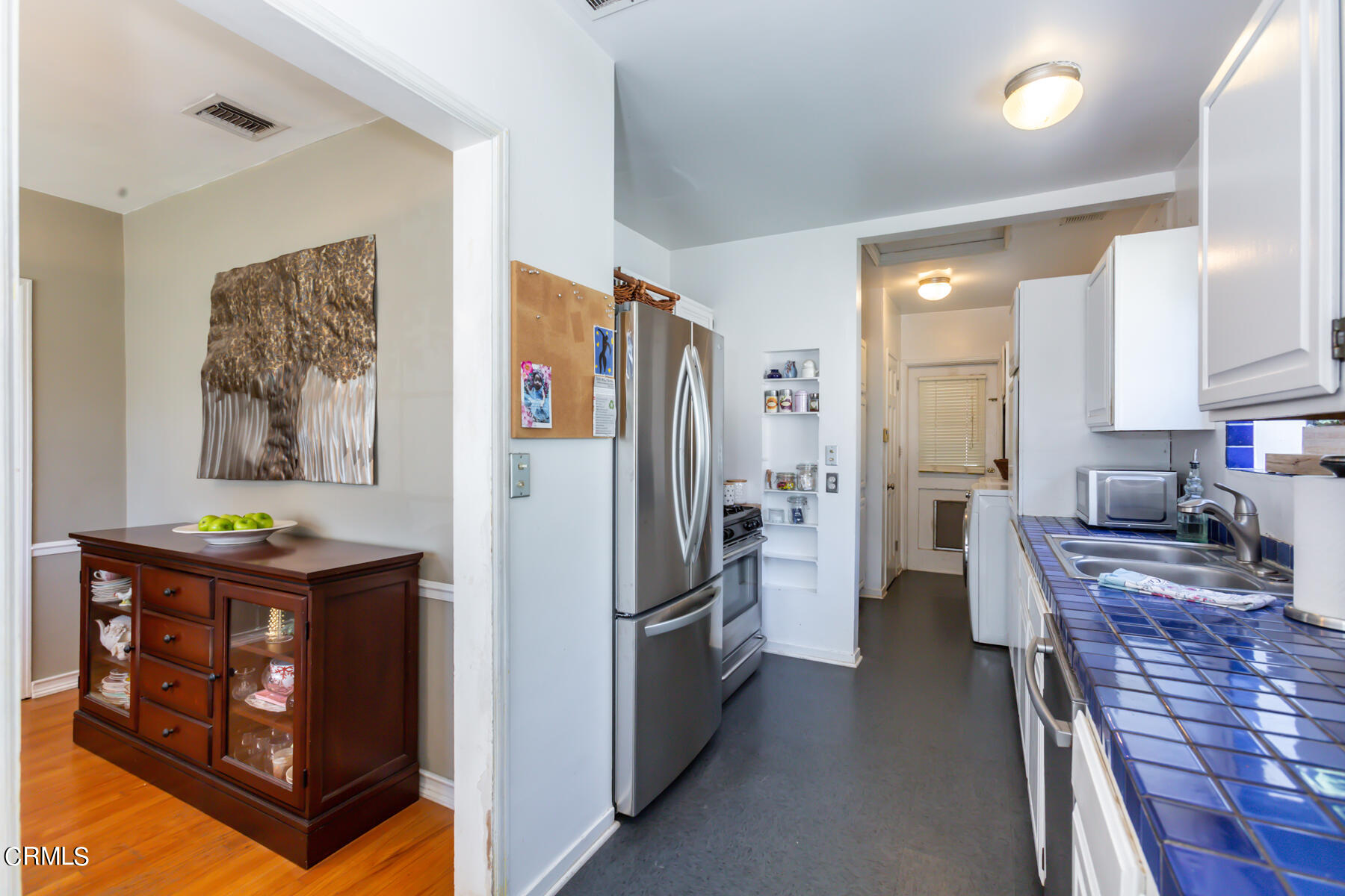 781 Morada Place Altadena, CA 91001 - Photo 22 of 41 a kitchen with stainless steel appliances granite countertop a refrigerator and a stove