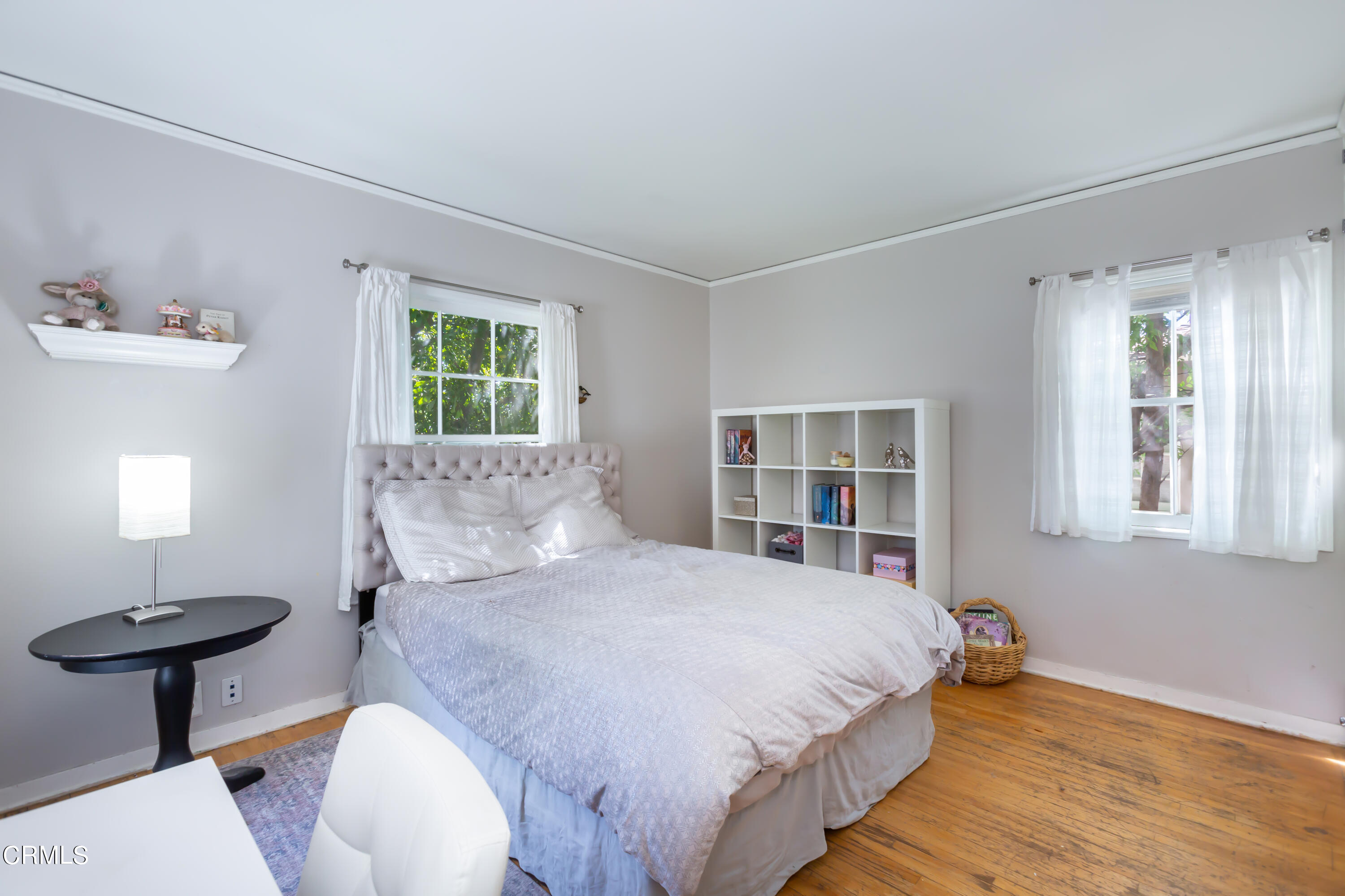 781 Morada Place Altadena, CA 91001 - Photo 26 of 41 a bedroom with a bed and a chair