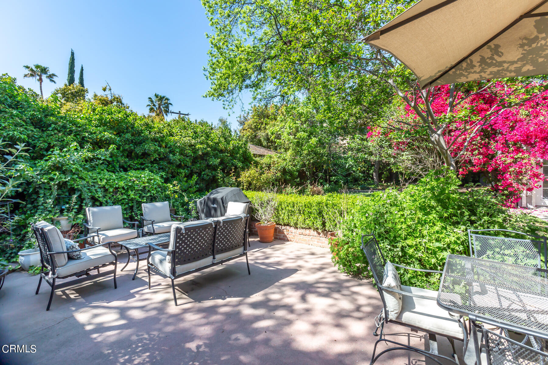 781 Morada Place Altadena, CA 91001 - Photo 35 of 41 a backyard of a house with fire pit and outdoor seating