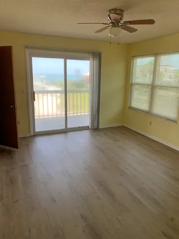 a view of an empty room with a window