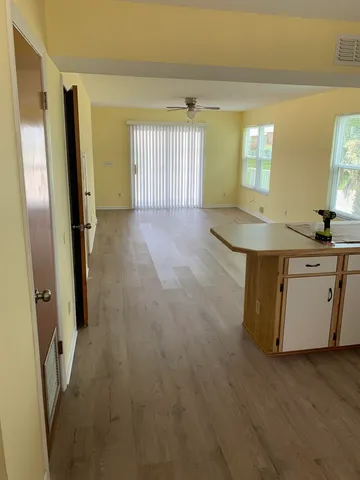 a view of a kitchen cabinets and wooden floor