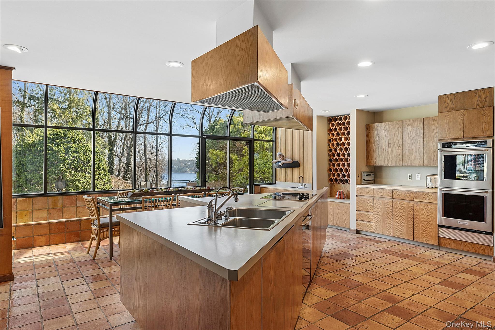 45 SE Road Sands Point, NY 11050 - Photo 12 of 36 a kitchen with sink attached with living room