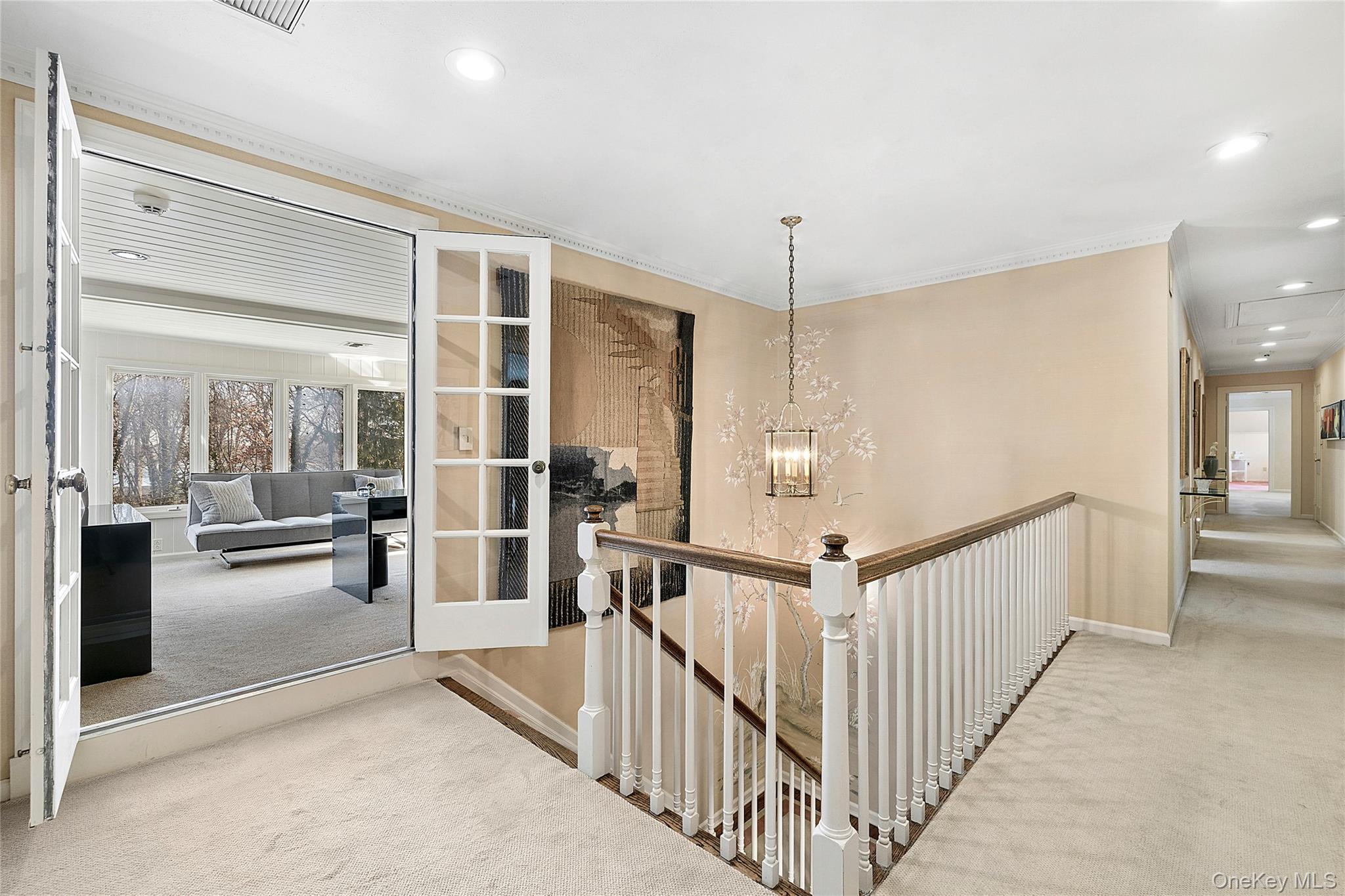45 SE Road Sands Point, NY 11050 - Photo 15 of 36 a view of a hallway with wooden floor and dining room view