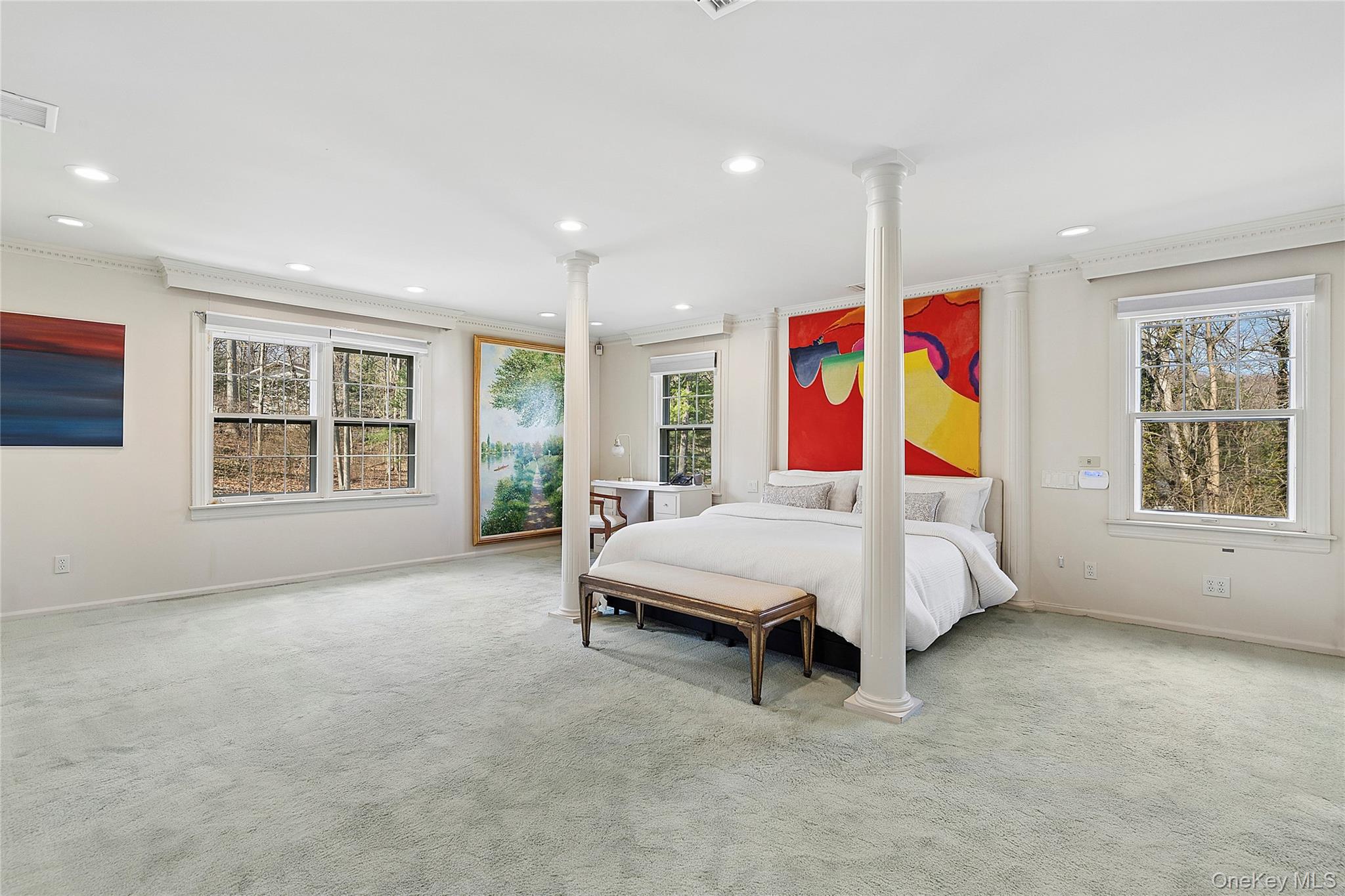 45 SE Road Sands Point, NY 11050 - Photo 16 of 36 a bedroom with furniture and windows